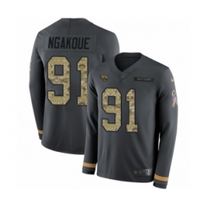 Men's Nike Jacksonville Jaguars #91 Yannick Ngakoue Limited Black Salute to Service Therma Long Sleeve NFL Jersey