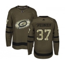 Men's Carolina Hurricanes #37 Andrei Svechnikov Green Salute to Service Stitched Hockey Jersey